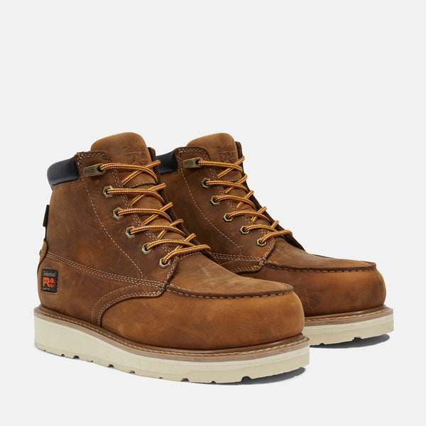 A pair of brown Timberland PRO Gridworks 6 inch waterproof work boots with alloy toes and white sole.
