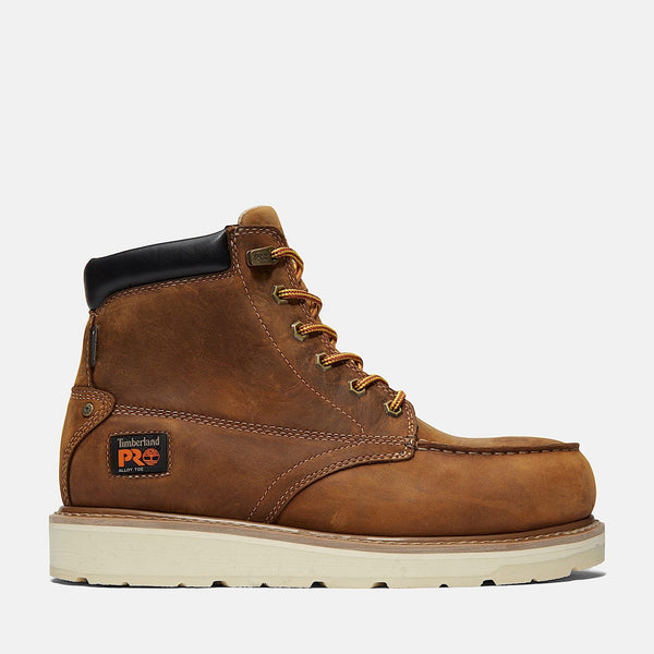 Side of brown work boot with white sole on a white background