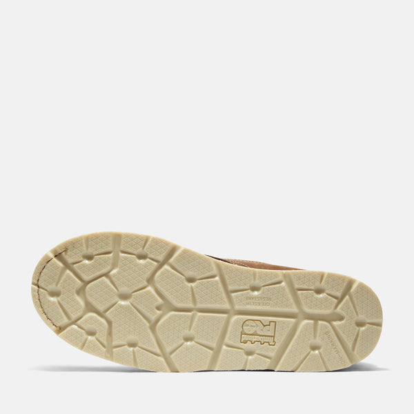 Beige sole of a work boot on a white background