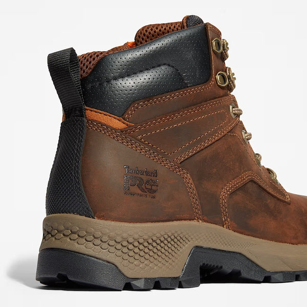 Close-up of a brown leather boot with black sole on a white background.
