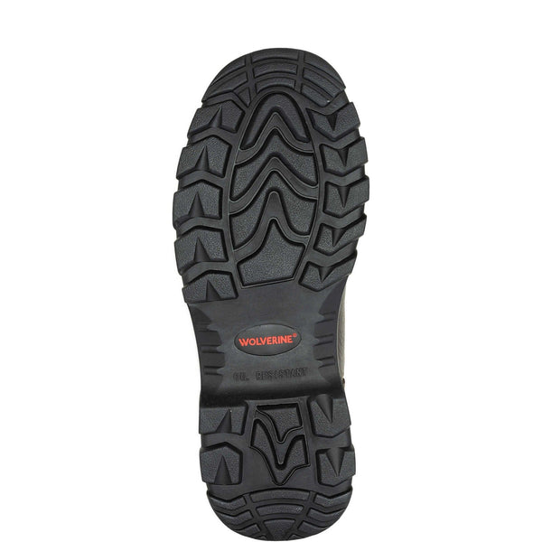 Black boot sole with tread pattern on wolverine logoon a white background