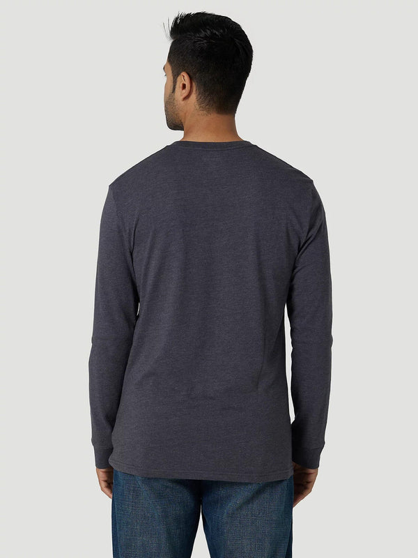back of man wearing dark grey long sleeve t-shirt and blue jeans