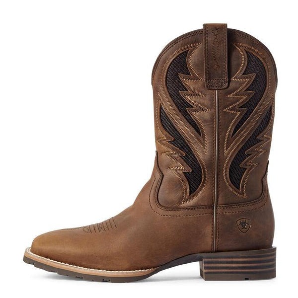 side view of light brown square-toed cowboy boot