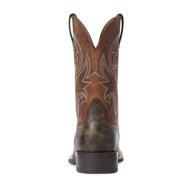 rear view of Two toned brown and black cowboy boots with white and blue embroidery
