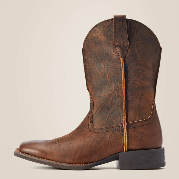 left side view of dark brown cowboy boot with heavy distressed textured leather