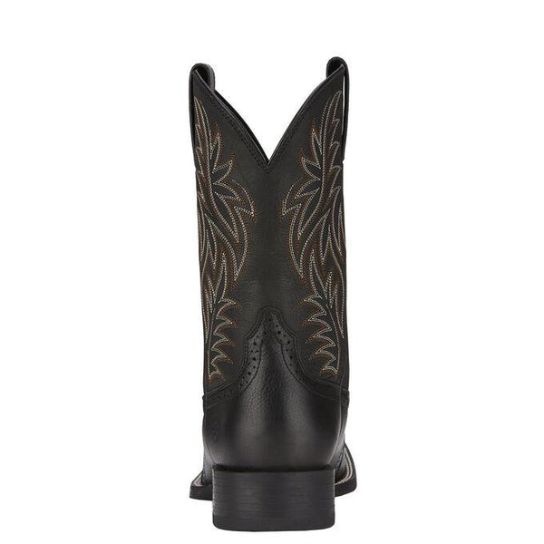 back view of black cowboy boot with white and light brown embroidery 