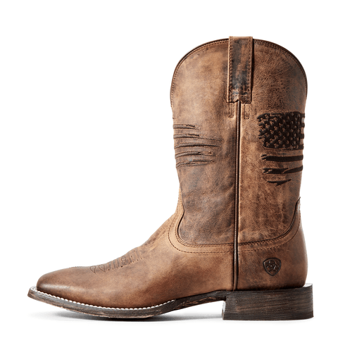 side view of Brown distressed cowboy boot with a rugged American flag embroidered across the shaft