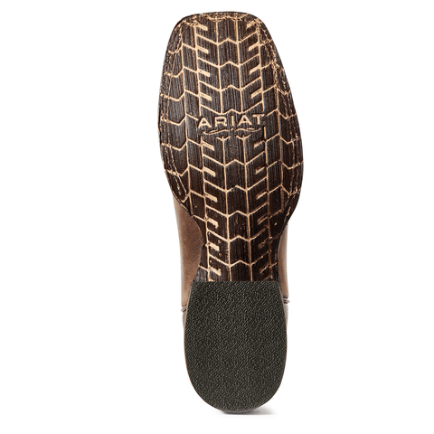 brown sole of a cowboy boot with  chevron-like pattern