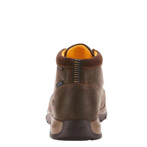 Back view of a brown work boot with a yellow lining inside and the Ariat logo embosses on the heel