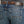 Load image into Gallery viewer, back pocket close up view of man wearing blue jeans with white stitching and a charcoal shirt and brown belt
