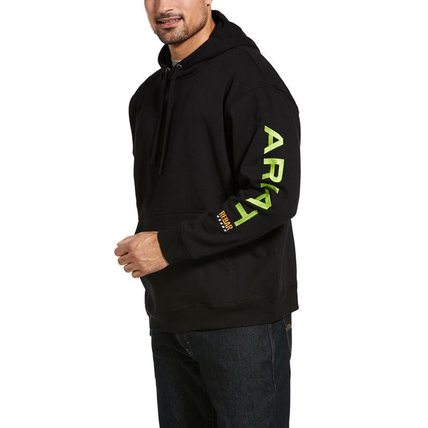 man wearing black hoodie with green writing on the sleeve that says Ariat