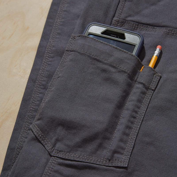 grey pants with a phone and pencil in a side leg pocket