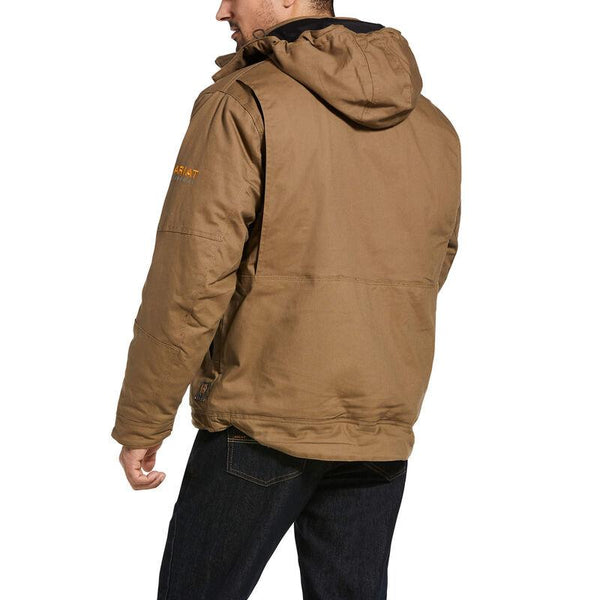 back view of man wearing a brown insulated coat and dark jeans