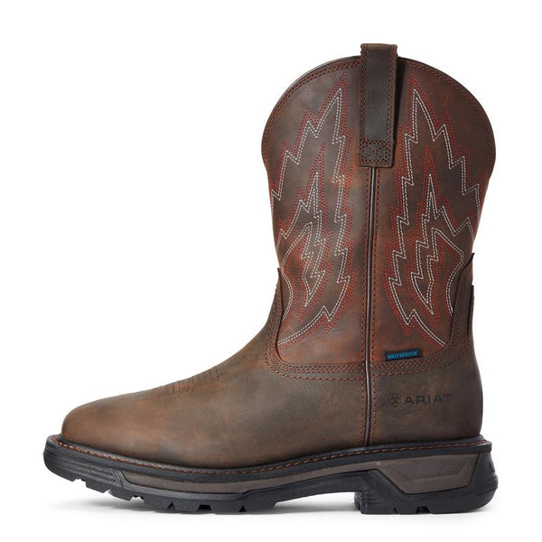 side view of red brown cowboy boot with white and orange embroidery 
