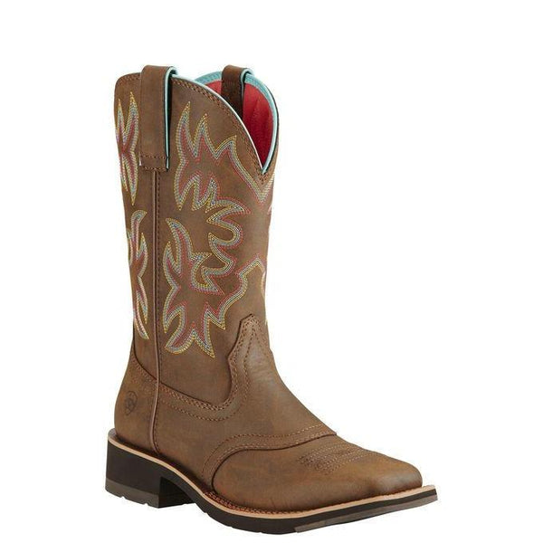 light brown cowgirl boot with pink, yellow, and light blue embroidery 