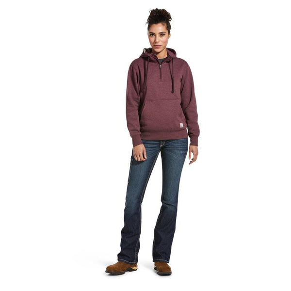 full body image of woman wearing maroon hoodie with kangaroo pocket and blue jeans