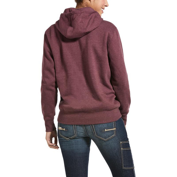 back view of woman wearing maroon hoodie with kangaroo pocket and blue jeans