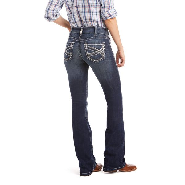 back full view of women's dark blue distressed boot leg denim jeans with white pocket stitching
