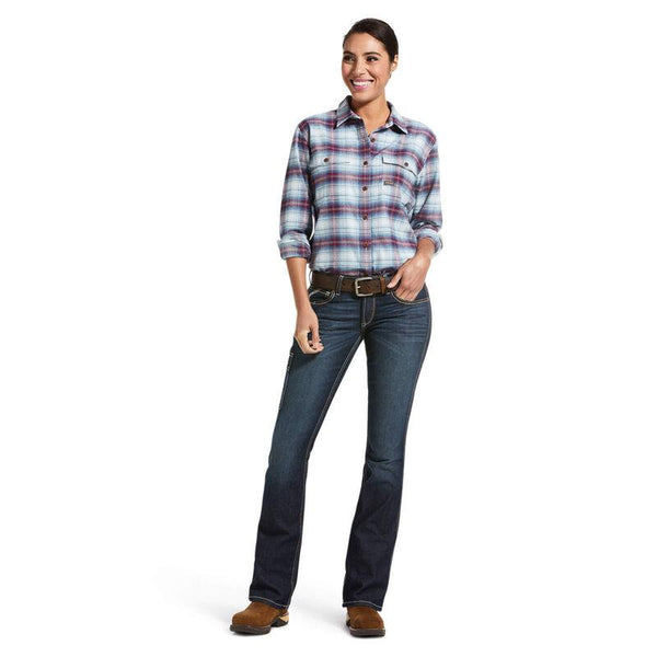 full body view of woman  wearing red and blue plaid and dark blue jeans