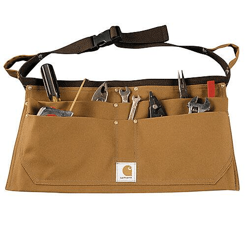 light brown leather duck nail apron with various tools in pouches