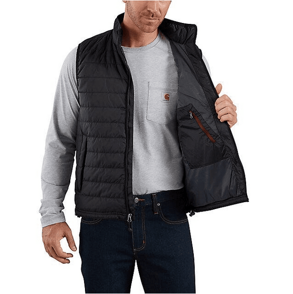 man holding one side of insulated black vest open showing zipper pocket over grey long sleeve shirt