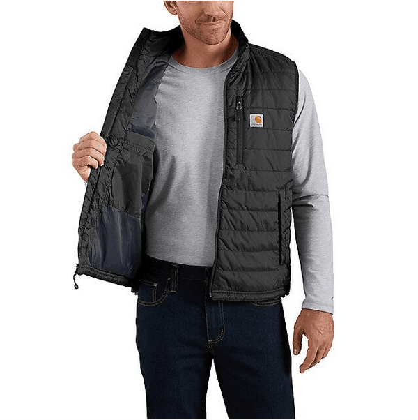 man holding one side of insulated black vest open over grey long sleeve shirt