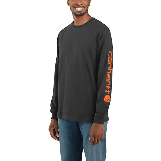 man smiling and wearing a dark grey long sleeve shirt with Carhartt logo on sleeve vertically