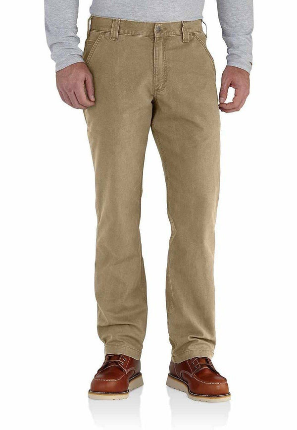 waist down of a main wearing dark khaki pants and brown shoes