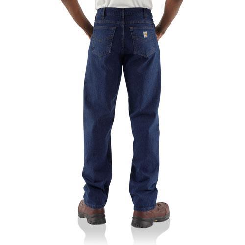 back view of man wearing dark denim jeans and brown boots