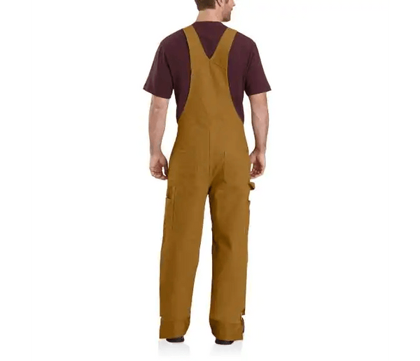 back view of man wearing brown bib insulated overalls