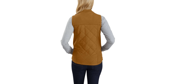 back of woman wearing khaki canvas insulated vest over grey long sleeve shirt