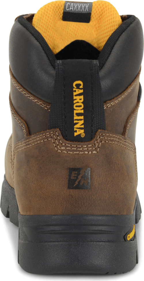 rear view of mid top brown suede work boot with black heel and sole