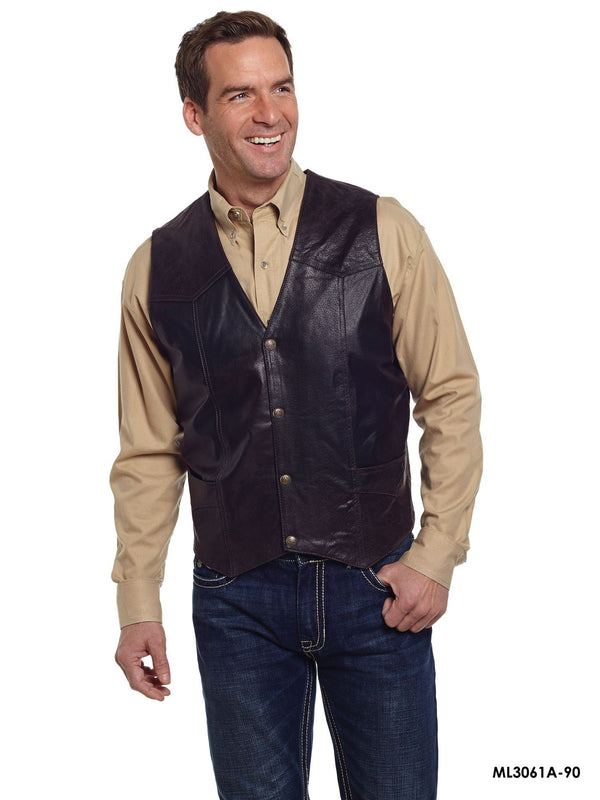 man smiling and wearing leather vest over brown long sleeve shirt