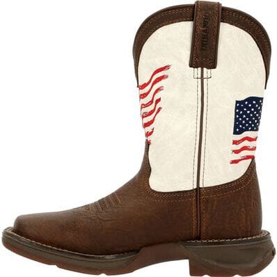 left side view of pull on square toe kids western cowboy boot with dark brown vamp, pull straps, and hem and white shaft with American flag on front and back