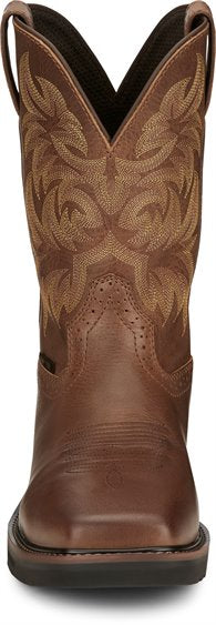front of brown cowboy boot with light brown embroidery and black sole
