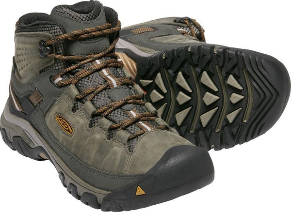 two grey/brown hiking boots with brown laces and black sole