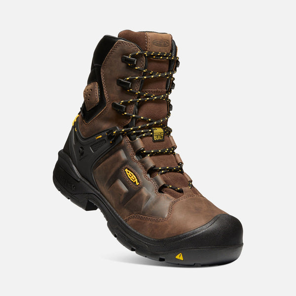 angled view of brown hightop boot with yellow and black laces, black toe guard and sole, black eyelets