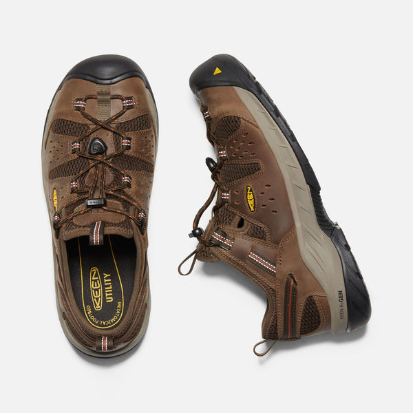 top view and side view of sneaker style brown outdoor shoes with black toe guard and brown laces