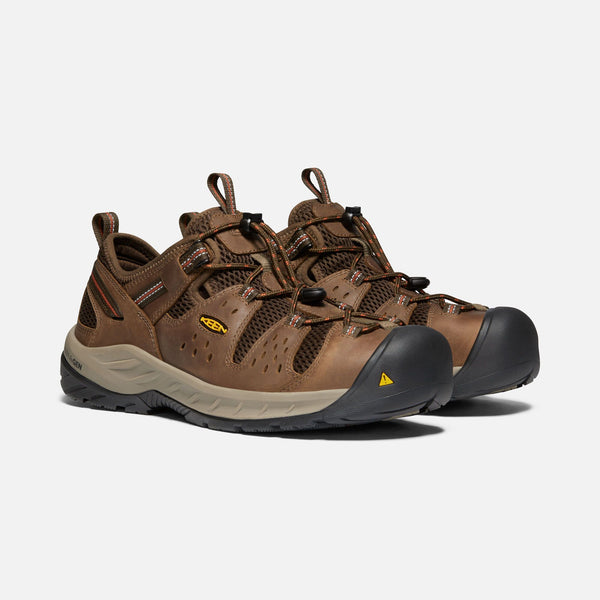 sneaker style brown outdoor shoes with black toe guard and brown laces