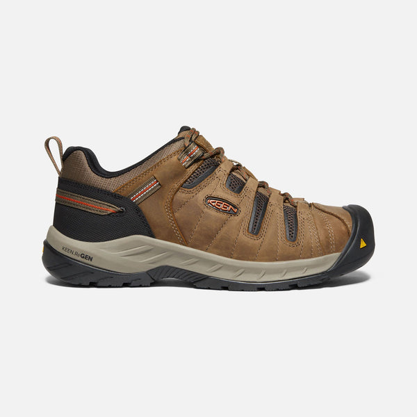 side of light brown outdoor shoe with black toe guard and brown laces