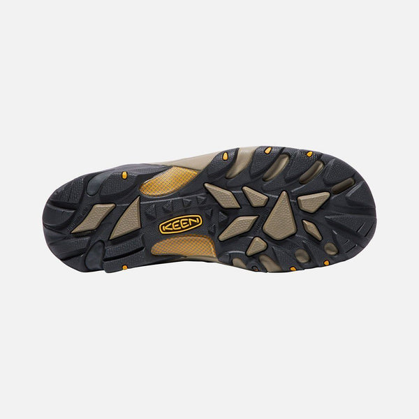 black and khaki sole with yellow logo in center