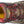 Load image into Gallery viewer, top of brown boot with red accents, red laces, and black toe guard

