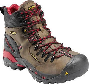 brown boot with red accents, red laces, and black toe guard