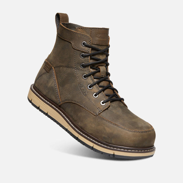 angled view of brown hightop shoe with dark laces and tan sole