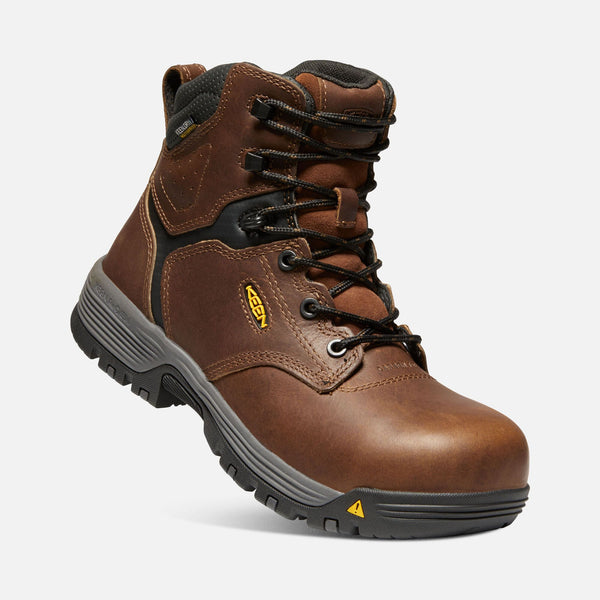 angled view of brown boot with black and grey sole, black laces and eyelets
