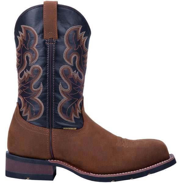 side of cowboy boot with black vamp with light brown and dark brown embroidery. light brown vamp