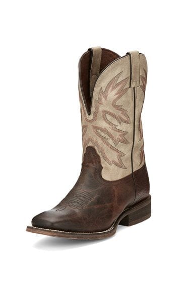 left front angle view of tall men's western boot with dark brown vamp and light stone upper with multi-colored stitching.