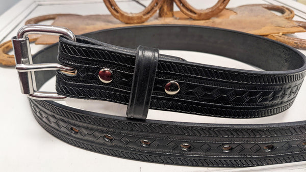 black leather belt with stamped design up close