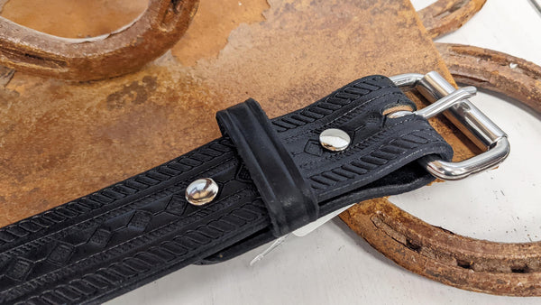angled black leather belt with stamped design