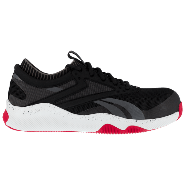 side of black and grey tennis shoe style lace up work shoe with white and red sole